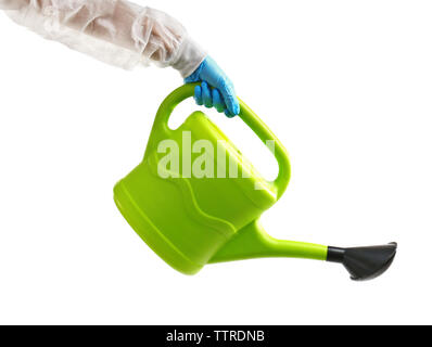Hand, die Gießkanne isoliert auf weiss Stockfoto