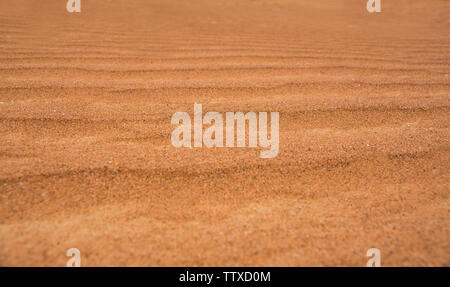 Nahaufnahme der Wüste Sand Dünen schöne orange Farbton Sand Textur Hintergrund Stockfoto