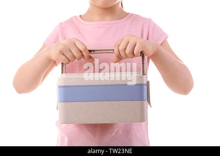 Schulmädchen holding Lunch Box auf weißem Hintergrund Stockfoto