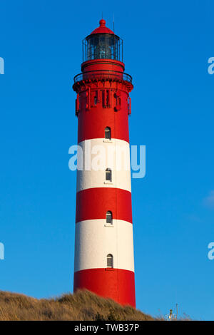 Deutschland, Schleswig-Holstein, Leuchtturm auf der Insel Amrum, Nordseeküste. Stockfoto