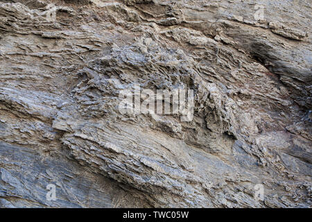 Naturstein Textur. Natürliche Beschaffenheit des Felsens Oberfläche, wo Sie die Zeilen in der langen Zeit gezeichnet sehen können. Kann als Hintergrund verwendet werden. Stockfoto