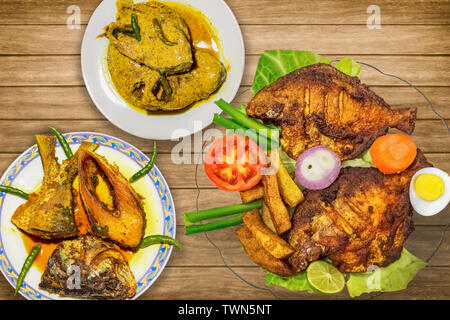 Indische Fisch essen (Küche) Gerichte auf Anzeige bestehend aus Frittierten butterfische Fisch mit rohu Fisch und hilsa Fisch Curry Stockfoto