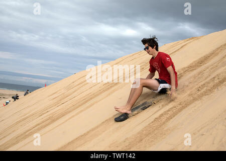 Sand Surfen, Stockton Strand, NSW, Australien Stockfoto