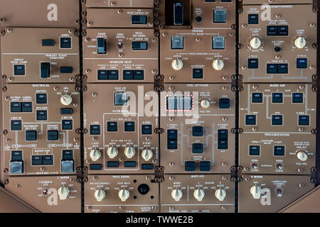 control panel knobs and buttons in a big jet plane cockpit Stockfoto