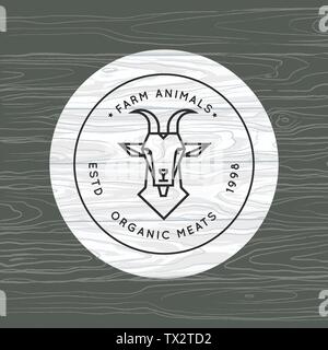 Eine Ziege ist in einem linearen Stil für eine Farm Logo auf dem Hintergrund der Vektor Holz Textur gezeichnet. Stock Vektor