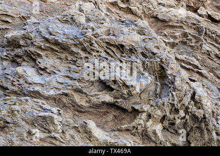 Naturstein Textur. Natürliche Beschaffenheit des Felsens Oberfläche, wo Sie die Zeilen in der langen Zeit gezeichnet sehen können. Kann als Hintergrund verwendet werden. Stockfoto