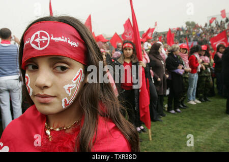 Palästinensische Anhänger der Volksfront für die Befreiung Palästinas (PFLP) nehmen an einer Rallye feiern den 43. Jahrestag ihrer Gründung in Gaza-stadt am 11. Dezember 2010. UPI/Ismael Mohamad Stockfoto