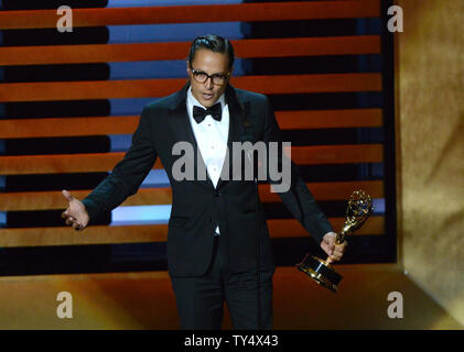 Cary Fukunaga nimmt die Auszeichnung für herausragende Regie für ein Drama Serie für seine Arbeit an 'true Detective' - 'Wer geht es während der Primetime Emmy Awards im Nokia Theater in Los Angeles am 25 August, 2014. UPI/Pat Benic Stockfoto