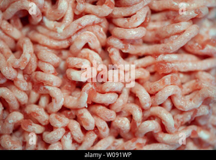 Hintergrund von rohem Hackfleisch. Textur von Schwein Hackfleisch, Ansicht von oben Stockfoto