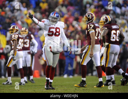 New York Giants line Backer Antonion Pierce (58) feiert die Giants defensive gegen die Washington Redskins während des vierten Quartals bei FedEx Field in Landover, Maryland am 30. November 2008. (UPI Foto/Kevin Dietsch) Stockfoto
