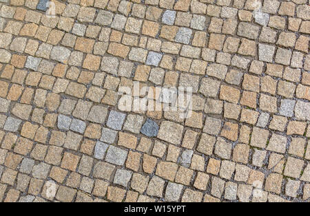 Grau und Rot Granit gepflasterten Gehsteig. Natürliche Hintergrund. Stockfoto