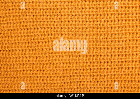 Wolle gestrickt Textur leuchtend gelben oder Senf Farbe close-up Stockfoto