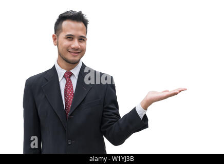Gut aussehender Geschäftsmann lächelnd mit der Hand Palm mit leeren weißen Hintergrund Stockfoto