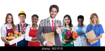 Erfolgreiche türkische Business Trainee bei der Gruppe der lateinamerikanischen und afrikanischen Lehrlinge auf einem isolierten weißen Hintergrund für Ausschneiden Stockfoto