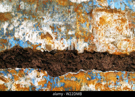 Bunte Texturen in der Nähe zu einer alten bemalten Stein mauer in Rom, Italien. Stockfoto