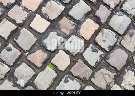 Steinboden Hintergrund mit Unkraut. Modernes Design Stockfoto