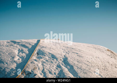 Winterwandern in Mourne Mountains, Slieve Commedagh Peak, Nordirland Stockfoto