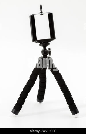 Mini Stativ für Smartphone auf weißem Hintergrund Stockfoto