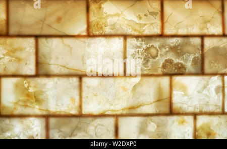 Onyx Mauer Hintergrund. Textur von Honig Farbe onyx Material. Stockfoto