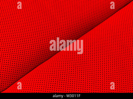 Moderner Luxus Auto rot Leder Interieur. Teil aus perforiertem Leder Autositz details. Red perforiertes Leder Textur Hintergrund. Textur, künstliche l Stockfoto