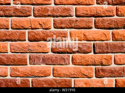 Hintergrund der Wandbeschaffenheit Muster aus rotem Backstein. Ideal für Graffiti Inschriften. Stockfoto