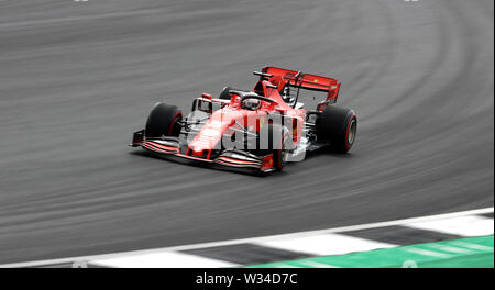 Ferrari Fahrer Sebastian Vettel in Aktion während der Praxis Tag für den Britischen Grand Prix in Silverstone, Towcester. Stockfoto