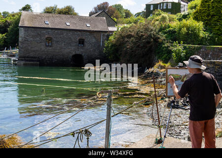 Männlicher Künstler Malerei Küstenlandschaft Castlehaven, West Cork, Irland Stockfoto