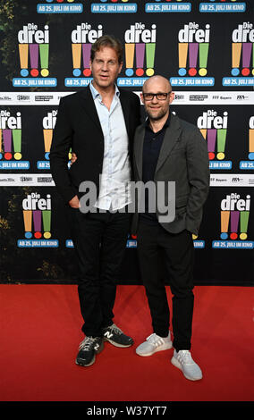 Köln, Deutschland. 13. Juli, 2019. Der Schauspieler Thomas Heinze (l) und Jürgen Vogel (r) zur Premiere der Film 'Die Drei !!!". Quelle: Henning Kaiser/dpa/Alamy leben Nachrichten Stockfoto