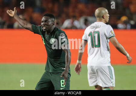 Kairo, Ägypten. 14. Juli, 2019. Nigerias Oghenekaro Etebo reagiert während der 2019 Afrika Cup Halbfinale Fußball Match zwischen Algerien und Nigeria an der Cairo International Stadium. Credit: Oliver Weiken/dpa/Alamy leben Nachrichten Stockfoto