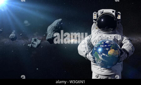Astronaut Schutz des Planeten Erde von Asteroiden Stockfoto