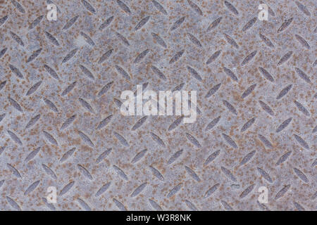 Industrielle Hintergrundbild von funktionalen Rutschfeste Metall diamond Plate und rauh erhöhte Fläche Muster. Kreative Hintergrund Makro der Konstruktion. Stockfoto
