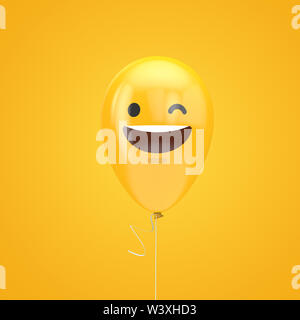 Lächelnd und mit einem Augenzwinkern emoji schwebende Ballon Stockfoto