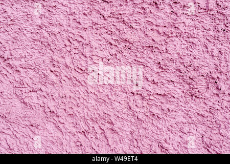 Rosa Textur von unebenen Putz auf der Wand des Hauses. Stockfoto