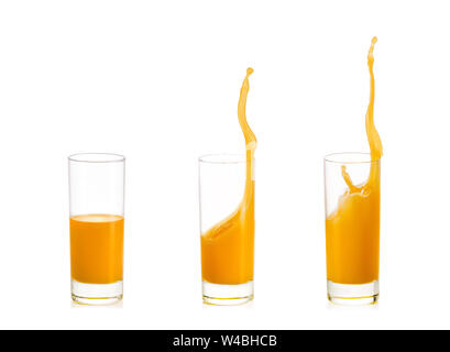 Drei Gläser Orangensaft mit Spritzen auf weißem Hintergrund. Stockfoto