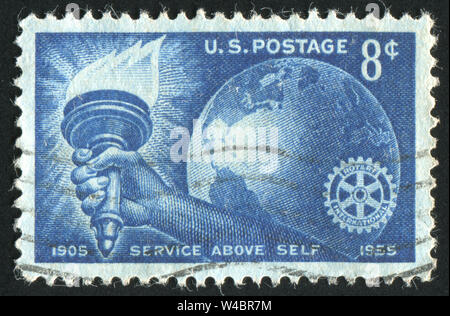 UNITED STATES - ca. 1955: Briefmarke von United States gedruckt, zeigt Taschenlampe Globe und Rotary Emblem, ca. 1955 Stockfoto