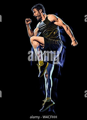 Eine kaukasische player Mann trainieren Fitness Cardio Boxing übung Body Combat studio Schuß auf schwarzen Hintergrund mit Licht malen blur Effekt isoliert Stockfoto