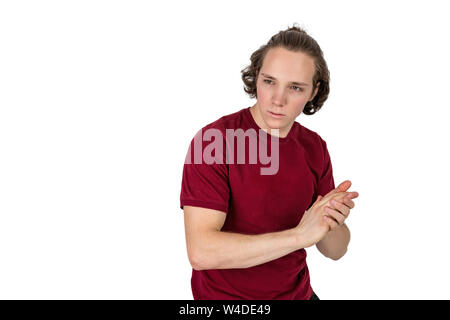 Jungen gutaussehenden Mann trägt casual t-shirt posiert im Studio Stockfoto