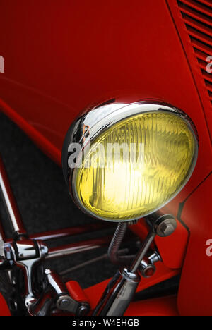 Close-up of Red Hot Rod Chrome Headlight Stock Photo