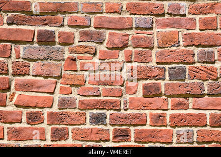 Hintergrund eine unregelmäßige Red brick wall Stockfoto