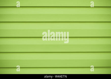 Abstrakte laufbelag Hintergrund. Grün Holz- Textur in horizontalen Streifen. Der Kalk Farbe, gelbe Wand in Linien, helle Oberfläche. Stockfoto