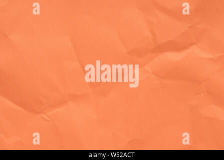 Farbe orange gefaltetes Papier Textur Hintergrund Stockfoto