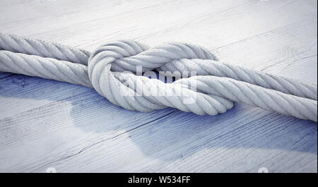 White reef Knot oder quadratischen Knoten auf weißem Holz - 3D-Darstellung Stockfoto