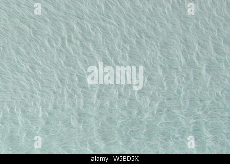 Textur von grauer Wolle zu Garn. Grau-grünen Abstrakt Hintergrund. Grauer wolle zum Filzen. Stockfoto