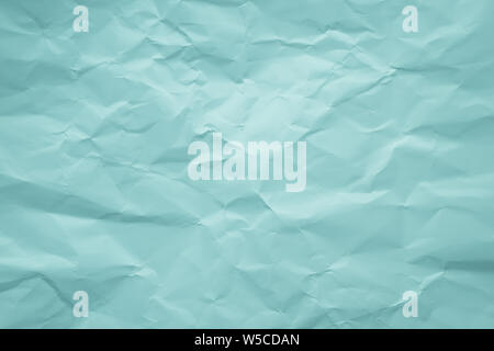 Zerknittertes Papier grün Hintergrund. Türkis Textur von zerknittertes Papier. Strukturierte Seite Aquamarin Farbe. Alte bemalte Blatt. Pastellfarben, weiche Farbe. Kopieren Stockfoto