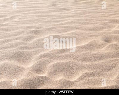 Strand verschwommenen Hintergrund. Sandy Shore Textur. Stockfoto