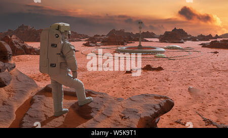 Astronaut auf dem Planeten Mars, auf einen Lebensraum in die Wüste Landschaft suchen Stockfoto
