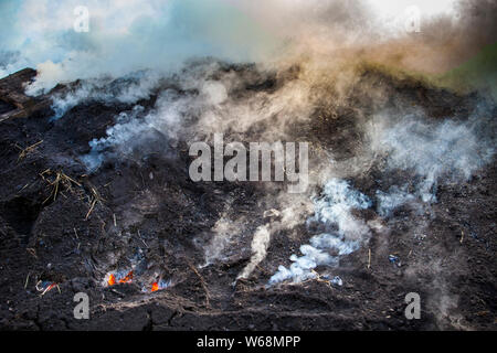 Charburners bei der Arbeit in Grevenbroich, Deutschland Stockfoto