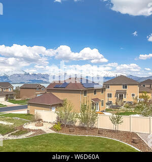 Square Scenic neighborhood calm lake and snowy mountain viewed from a balcony Stockfoto