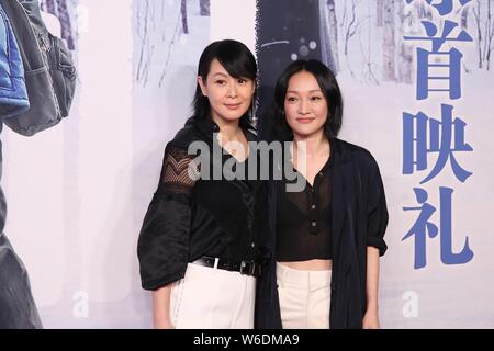 Chinesische Schauspielerin Zhou Xun, rechts, und taiwanesische Sängerin, Schauspielerin und Autorin Rene Liu besuchen eine Premiere für den Film 'Wir und Die' in Sein Stockfoto