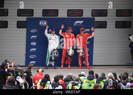 (Von links) Finnische F1 Fahrer Valtteri Bottas von Mercedes AMG GP, Deutschen F1-Fahrer Sebastian Vettel von Ferrari und Finnische F1 Fahrer Kimi Räikkönen von Stockfoto
